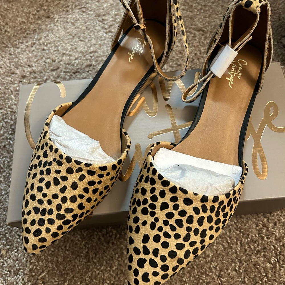 Brand new cheetah print shoes. Size 11. Stap is pony hair. Still in packaging.